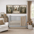 A styled nursery scene with a light gray crib, beige bedding and throw blanket, a white armchair, a wooden dresser, and three framed deer wall art prints above the crib. The center print reads 'Winston'.
 Baby Boy Crib Bedding Tan - The Creative Raccoon 