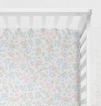Floral patterned crib sheet on a white crib.
Bow Crib Sheet - The Creative Raccoon
