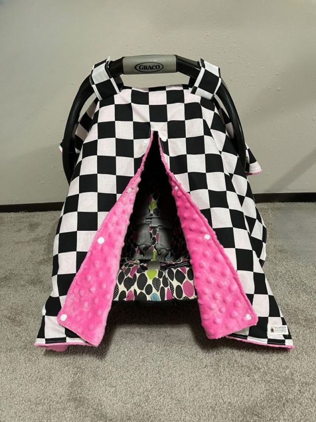 Black and white checkered car seat cover with pink interior. Car Seat Canopy Checkered - The Creative Raccoon