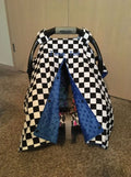 Checkered car seat cover with blue accents on a baby carrier
Car Seat Canopy Checkered - The Creative Raccoon