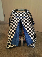 Checkered car seat cover with blue accents on a baby carrier
Car Seat Canopy Checkered - The Creative Raccoon