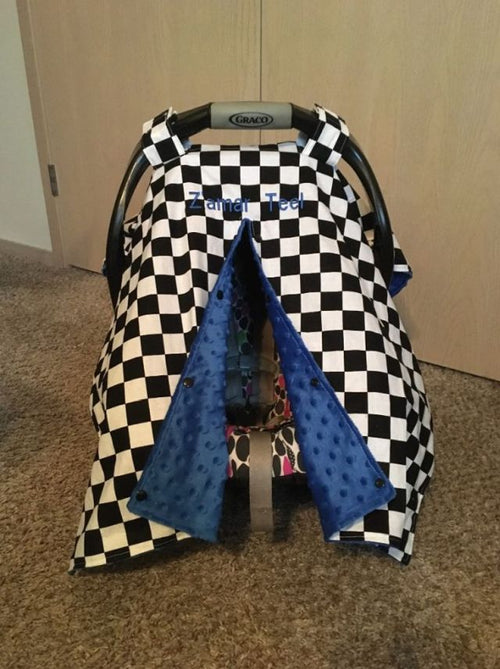Checkered car seat cover with blue accents on a baby carrier
Car Seat Canopy Checkered - The Creative Raccoon