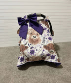 Car seat cover with Highland cow pattern and purple bow on a neutral background & a purple bow. Car Seat Canopy Highland Cows - The Creative Raccoon