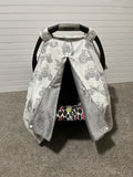 Car seat cover with tractor pattern on a plain background. Car Seat Canopy Tractors - The Creative Raccoon
