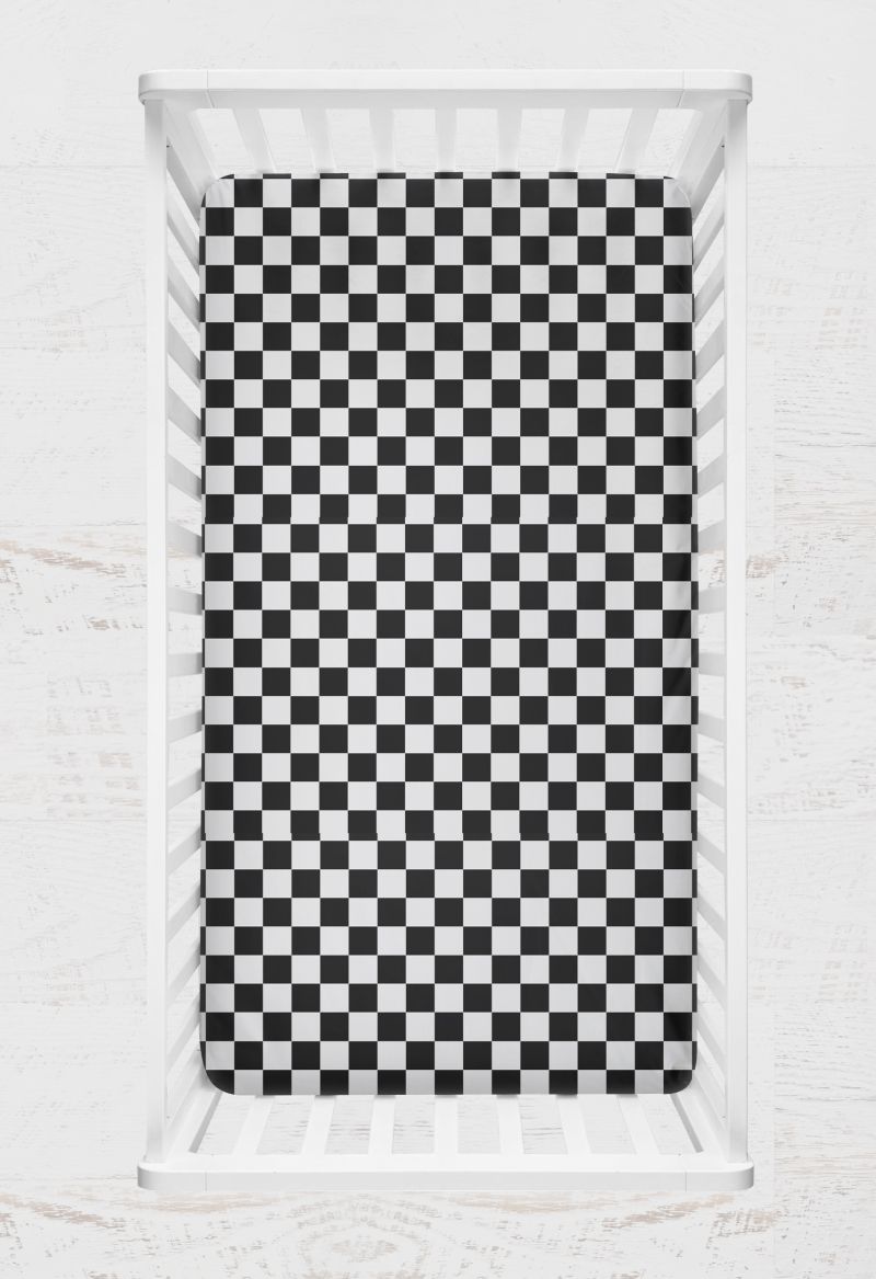 Checkered black and white crib sheet on a crib with a light gray background
Crib Sheet Racing Check - The Creative Raccoon