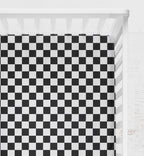Checkered black and white crib sheet on a crib with a light gray background
Crib Sheet Racing Check - The Creative Raccoon