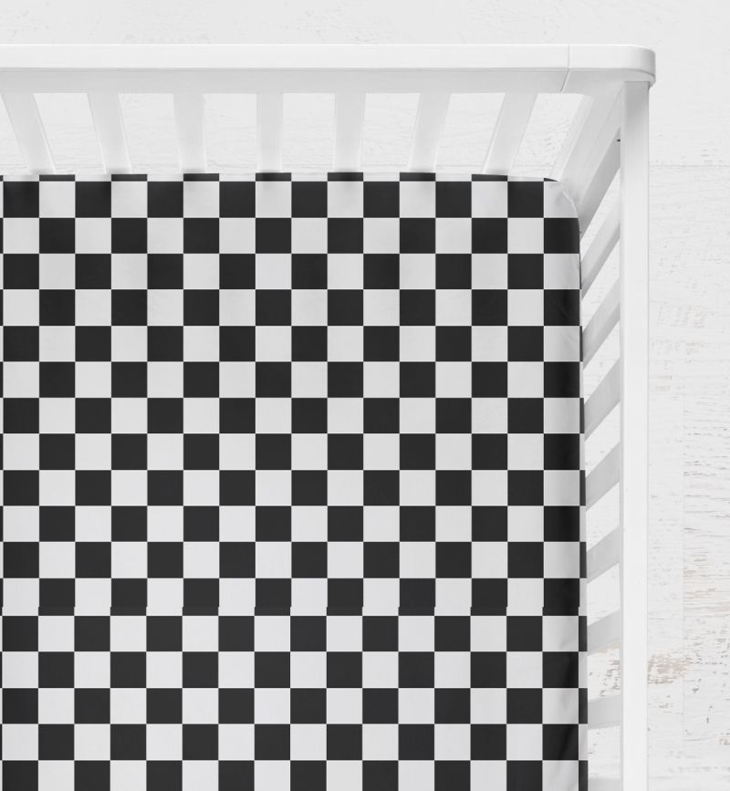 Checkered black and white crib sheet on a crib with a light gray background
Crib Sheet Racing Check - The Creative Raccoon