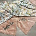 Floral-patterned blanket with embroidered names on a neutral background.  Daisy Baby Blanket - The Creative Raccoon